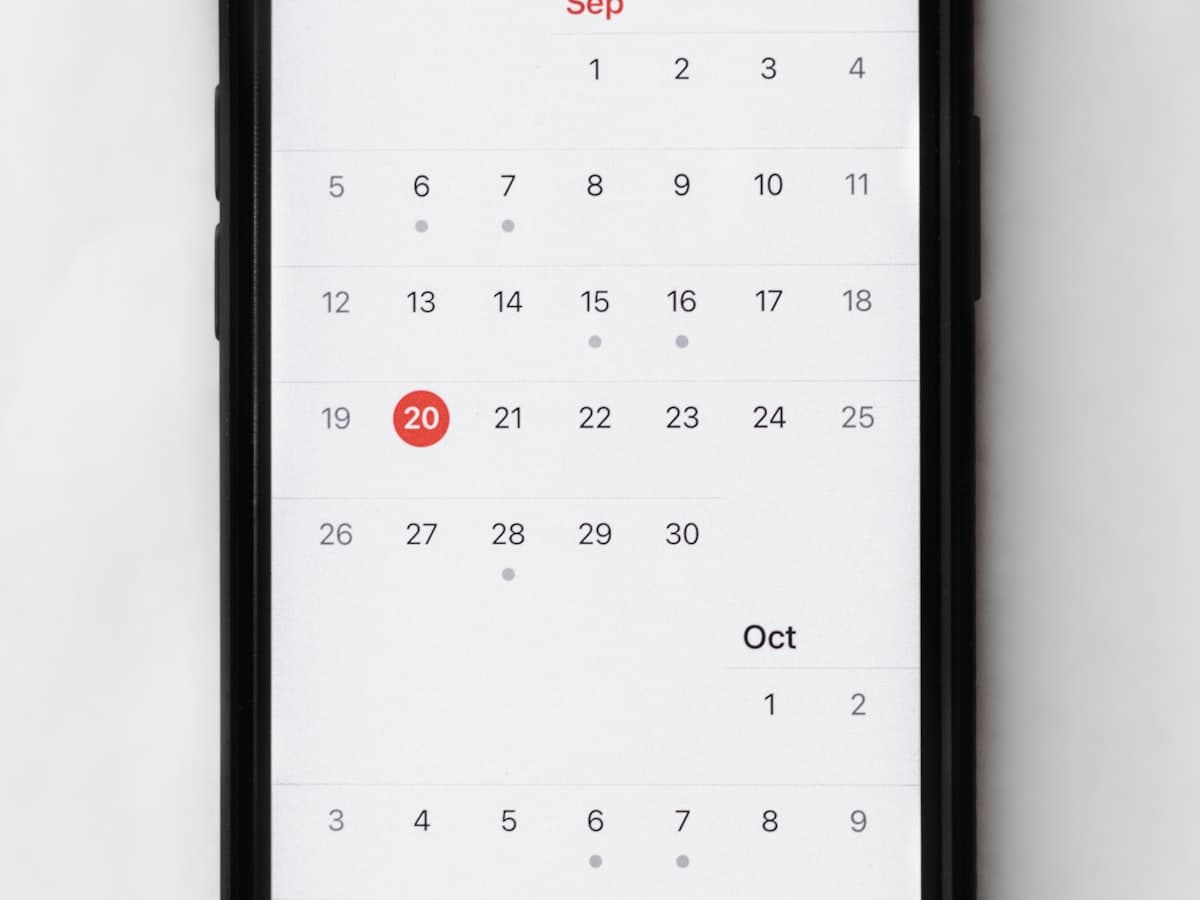 A phone showing a calendar app, open to pick a date
